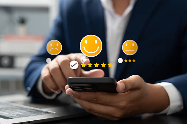 istock Happy customer providing 5-star review via mobile application after receiving outstanding service and quality product. Online customer feedback plays crucial role in business ranking, Consumer trust 2246189847