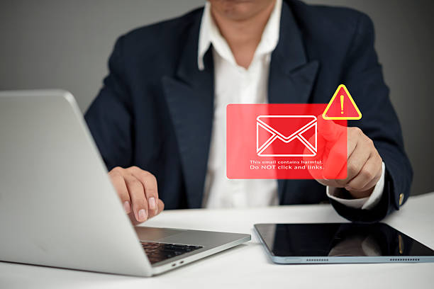 istock Businessman working laptop desk receive harmful email warning. Phishing scam malware virus alert icon. Cybersecurity technology data protection network security internet crime concept. 2246190480
