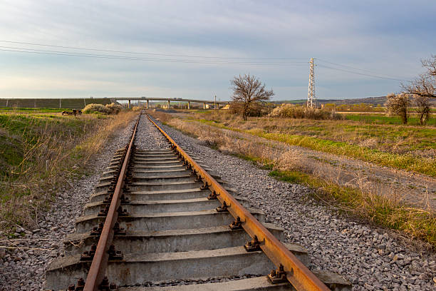 istock Empty railway tracks leading to an overbridge in Southern Bulgaria 2246192415
