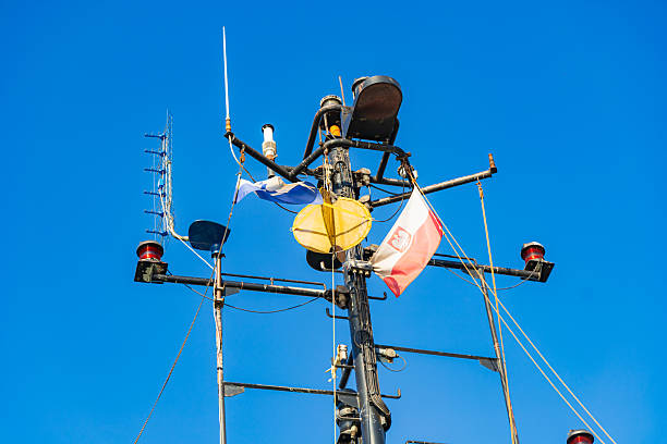 Storm Warning Flag at Newport Oregon near the Coast Guard Station. This was a very windy, blue sky day. Taken from the public sidewalk area.