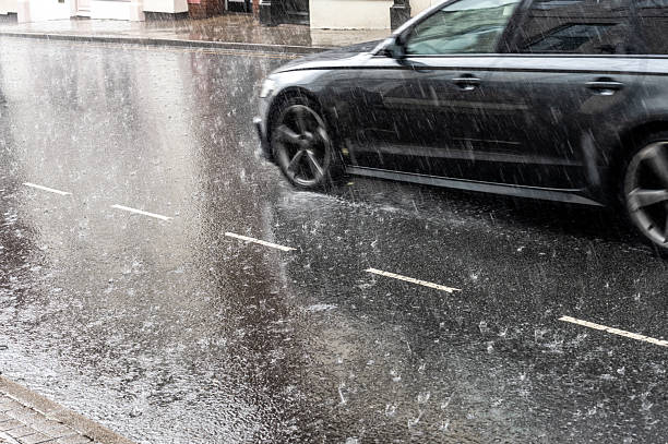 istock Town driving in very heavy rain 2246195621