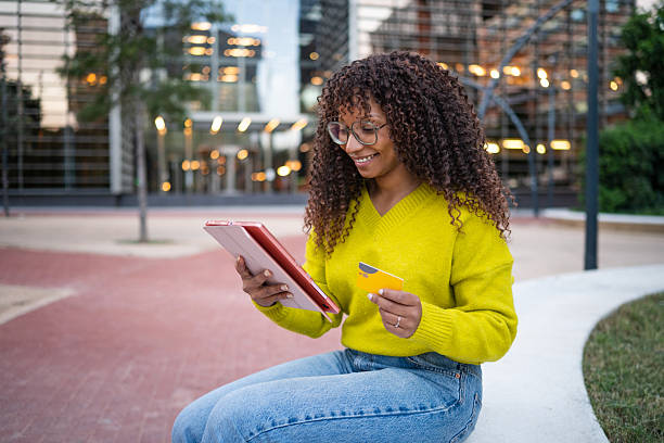 istock Woman making secure online payment with credit card and tablet 2246197319