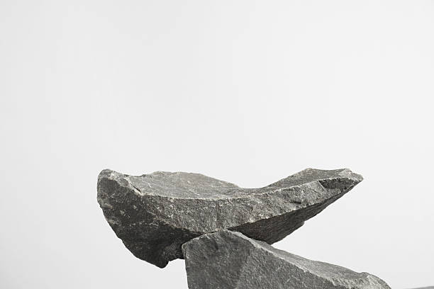 Presentation for product. Podium made of stones on light grey background. Space for text