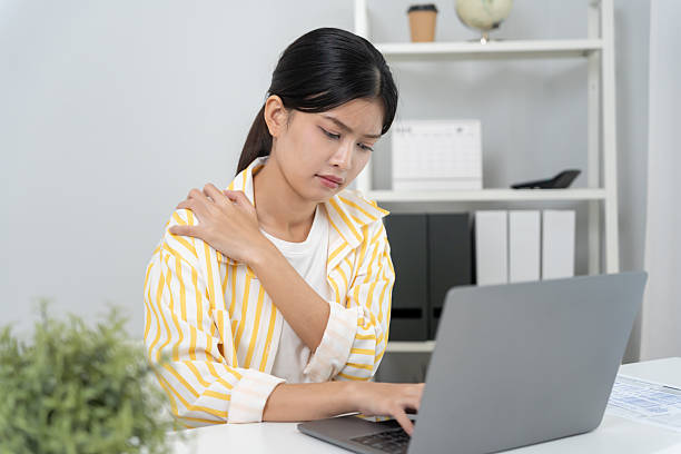 istock woman holding on shoulder and while and suffer from unbearable pain health and problems, chronic shoulder pain, shoulder ache in office syndrome, scoliosis, herniated disc, muscle inflammation 2246199839