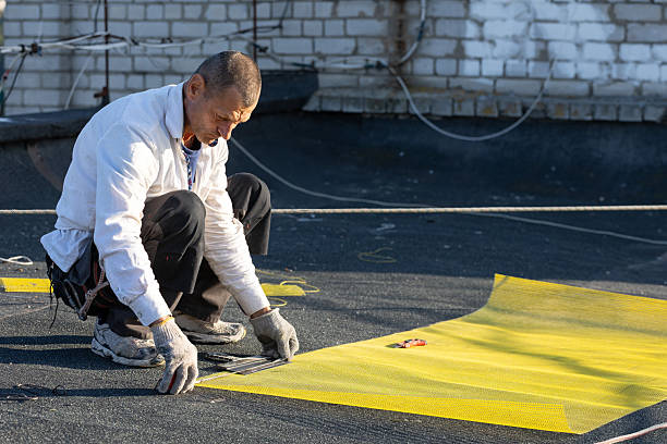 istock The construction worker measures the length of the reinforcing mesh for construction work. 2246200421