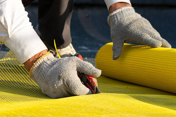 istock The builder’s hands cut the yellow reinforcing mesh into two pieces using a utility knife. 2246200476