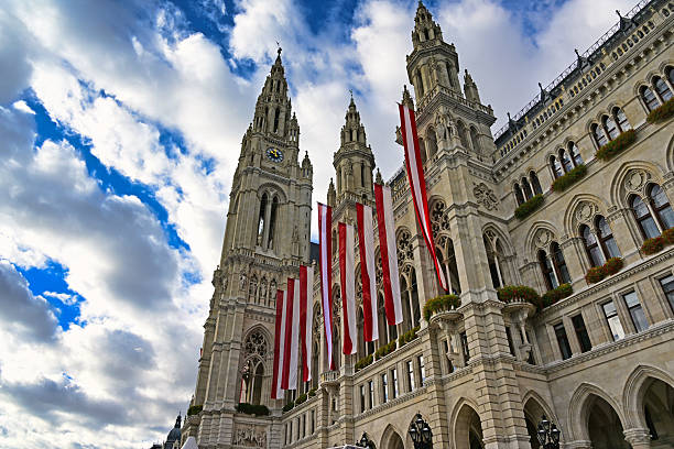 Vienna's Town Hall with Austrian flags,Rathaus, Vienna. Austria.