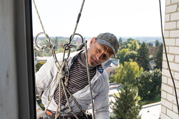 istock Portrait of the construction worker at height during facade insulation work. 2246201148