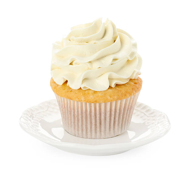 istock Tasty vanilla cupcake with cream isolated on white 2246201714