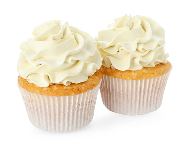 istock Tasty vanilla cupcakes with cream isolated on white 2246201717
