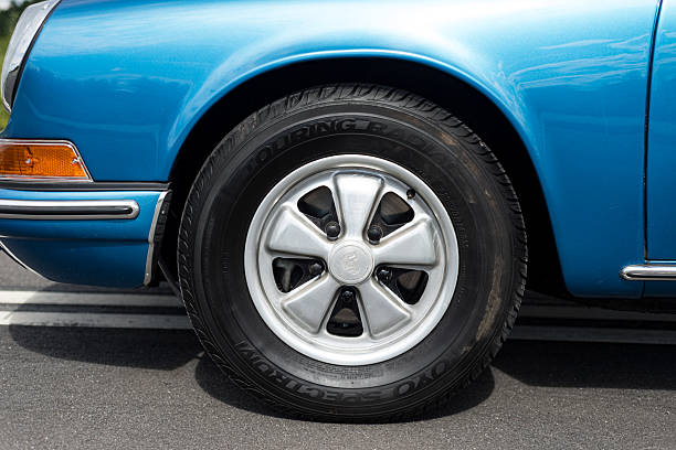 Vilnius, Lithuania - August 10, 2023: Classic R14 Fuchs wheels on a fully restored, blue metallic Porsche 911 Targa.