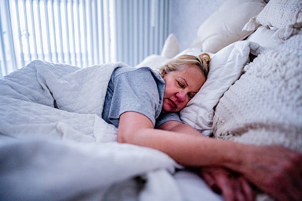 istock Senior woman resting at home 2246203392