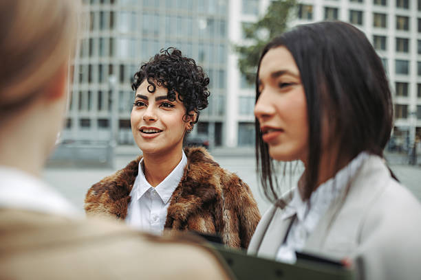 istock Three businesswomen talking in city 2246203637