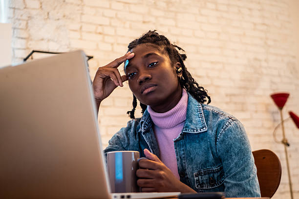 istock Young woman working using laptop at home 2246208927