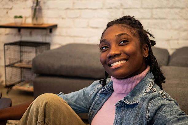 istock Young woman looking away at home 2246208940