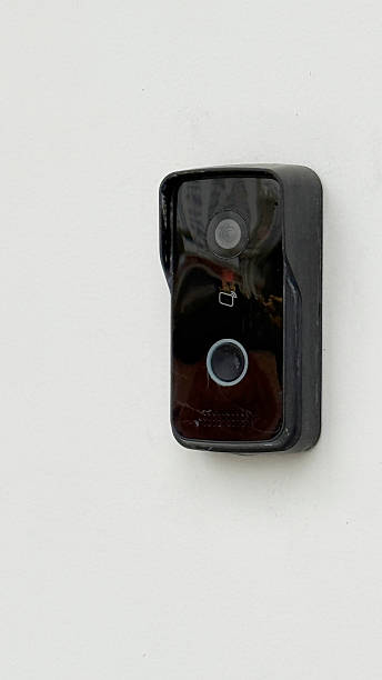 istock Doorbell camera mounted on white wall, providing home security and surveillance 2246213196