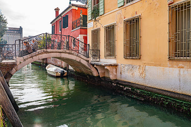 Gondola Sailing in the Venetian Canals with tourist, Venice, Italy.