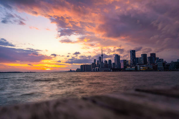 Panoramic view of Toronto skyline with skyscrapers, business centers and residential apartments and Lake Ontario on a sunny summer day, Toronto, Ontario, Canada.