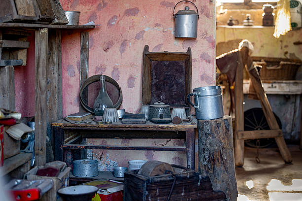 istock Vintage Kitchen Interior with Rustic Metal Cookware and Weathered Pink Wall in Traditional Old House 2246223585