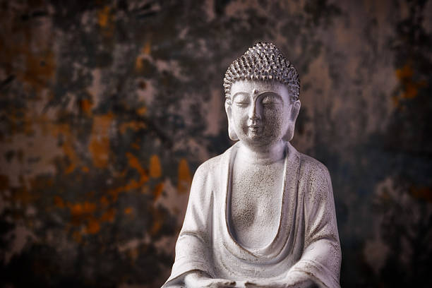 istock Meditating Buddha Statue on dark background. Soft focus. Close up. Copy space. 2246224992