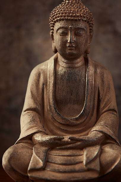 istock Meditating Buddha Statue on dark background. Soft focus. Close up. Copy space. 2246225169