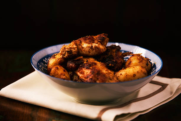 istock Fried chicken breast with potatoes. Rustic wooden background. Soft focus. 2246225180
