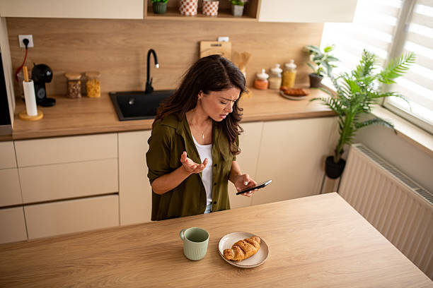 istock Young woman irritated with phone at home 2246225208