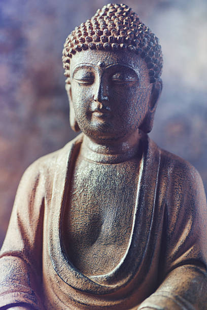 istock Meditating Buddha Statue on dark background. Soft focus. Close up. Copy space. 2246225218