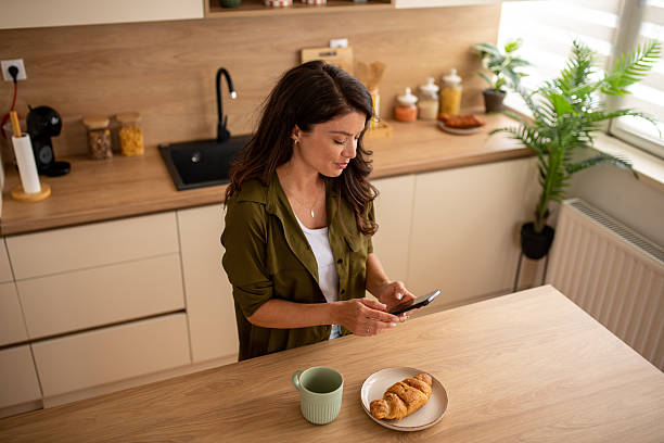 istock Morning routine with coffee and smartphone at home 2246225220
