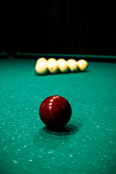 The man playing billiards