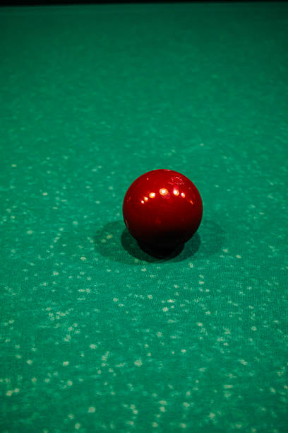 Selective focus at billiard ball on blue table