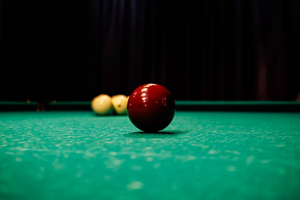 istock Billiard table with arranged balls under soft lamp lighting in a dark room, creating an atmosphere of solitude, focus, and quiet gameplay 2246228530