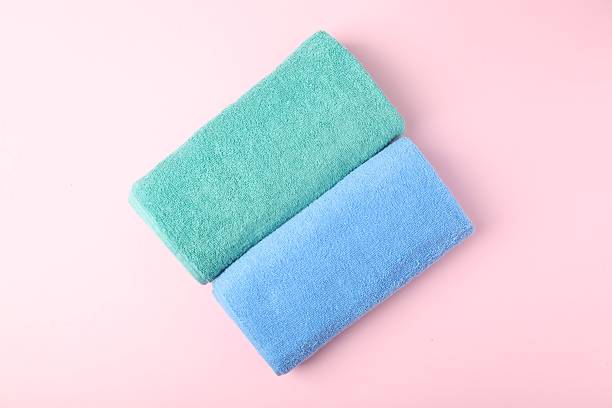 istock Bright terry towels on pink background, top view 2246233674