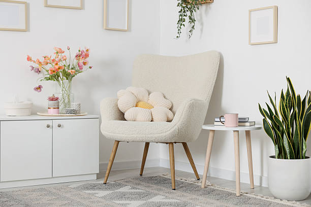 istock Stylish armchair with cushion in room. Interior design 2246233824