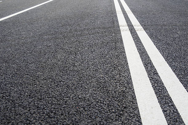 istock double solid line on asphalt surface of city road 2246234606