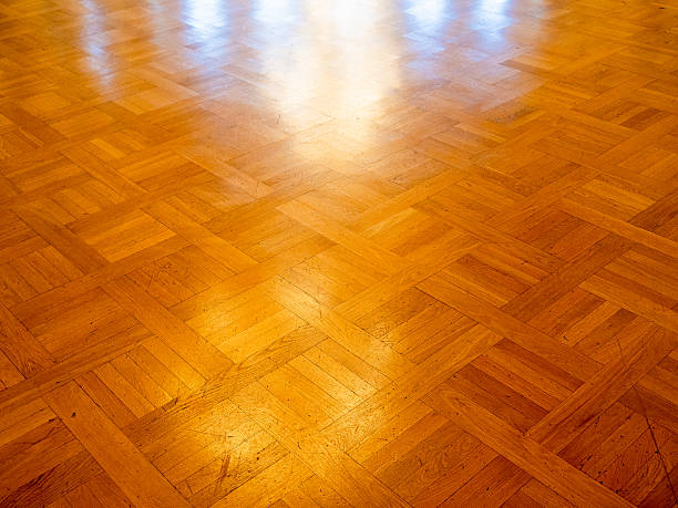 istock sunlit old wooden parquet flooring 2246234627