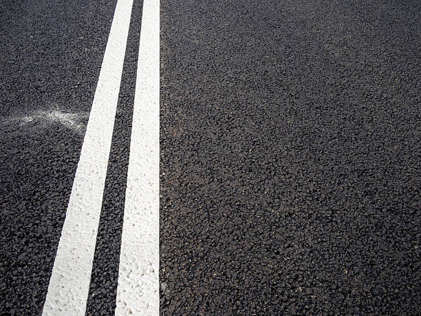 istock double solid line on new asphalt of city highway 2246234631