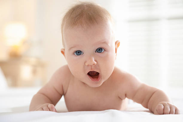 istock Cute baby after bathing on bed, closeup 2246235508