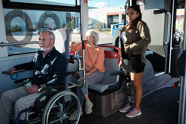 istock Diverse passengers with disabilities riding public transport bus 2246237425