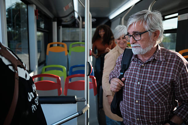 istock Senior man commuting on public transport bus 2246237472