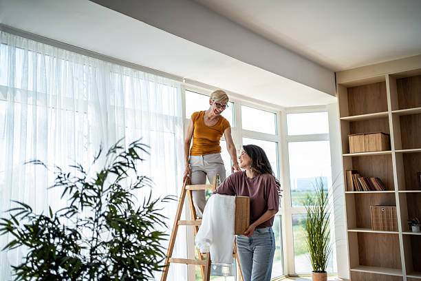 istock Women decorating apartment, setting up new home 2246239224