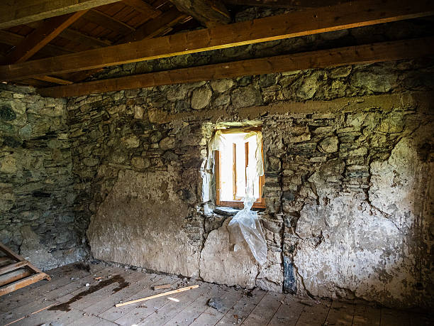 window on ground floor of ancient svan tower in Mestia town in Samegrelo-Zemo Svaneti province of Georgia on summer day