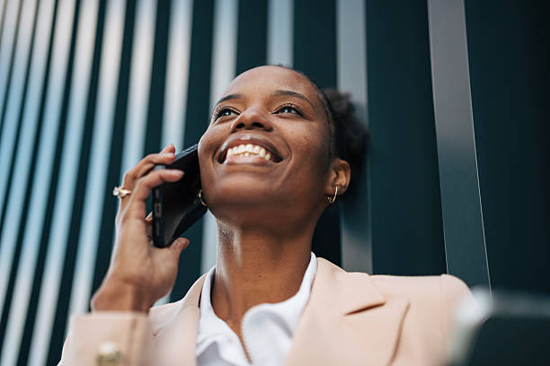 istock Smiling business woman talking on smartphone 2246240072