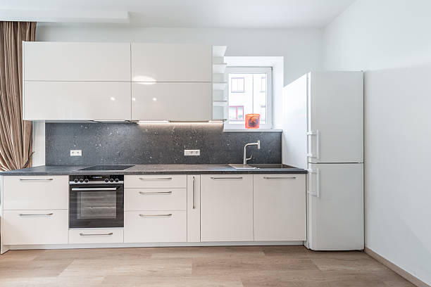 istock Modern Home Minimalist Kitchen Interior with Light Cabinets and Sleek Countertops 2246240137