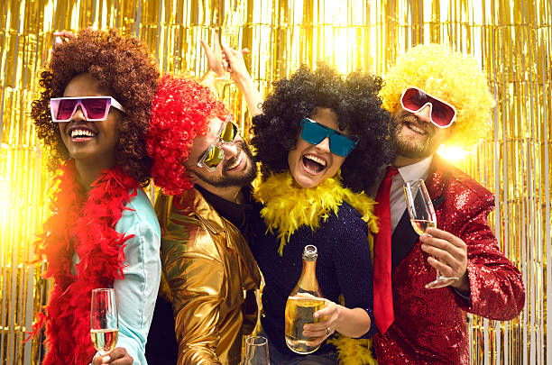 istock Happy millennials friends celebrating drinking champagne and making party 2246241636