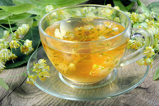 istock cup of linden tea on a wooden table. vitamins tea. 2246242431