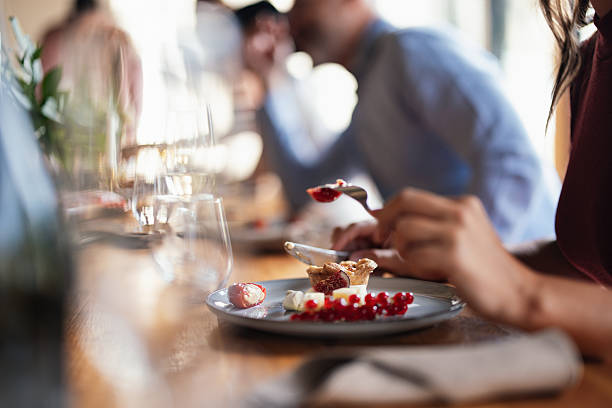 istock Friends Sharing Dessert At A Long Table During A Casual Lunch Celebration 2246245235