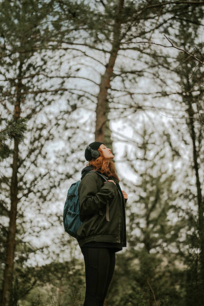 A woman with a backpack walking