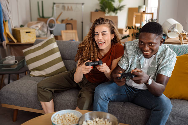 istock Young couple competing in video games at home 2246247712