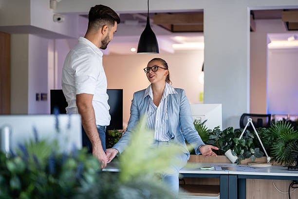 istock Business colleagues having discussion during work break in modern office 2246248909